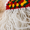 Close-up of the soft white fringe detailing on the handmade Boho Chic Crochet Halter Top, showcasing premium crochet craftsmanship and textured cotton yarn.