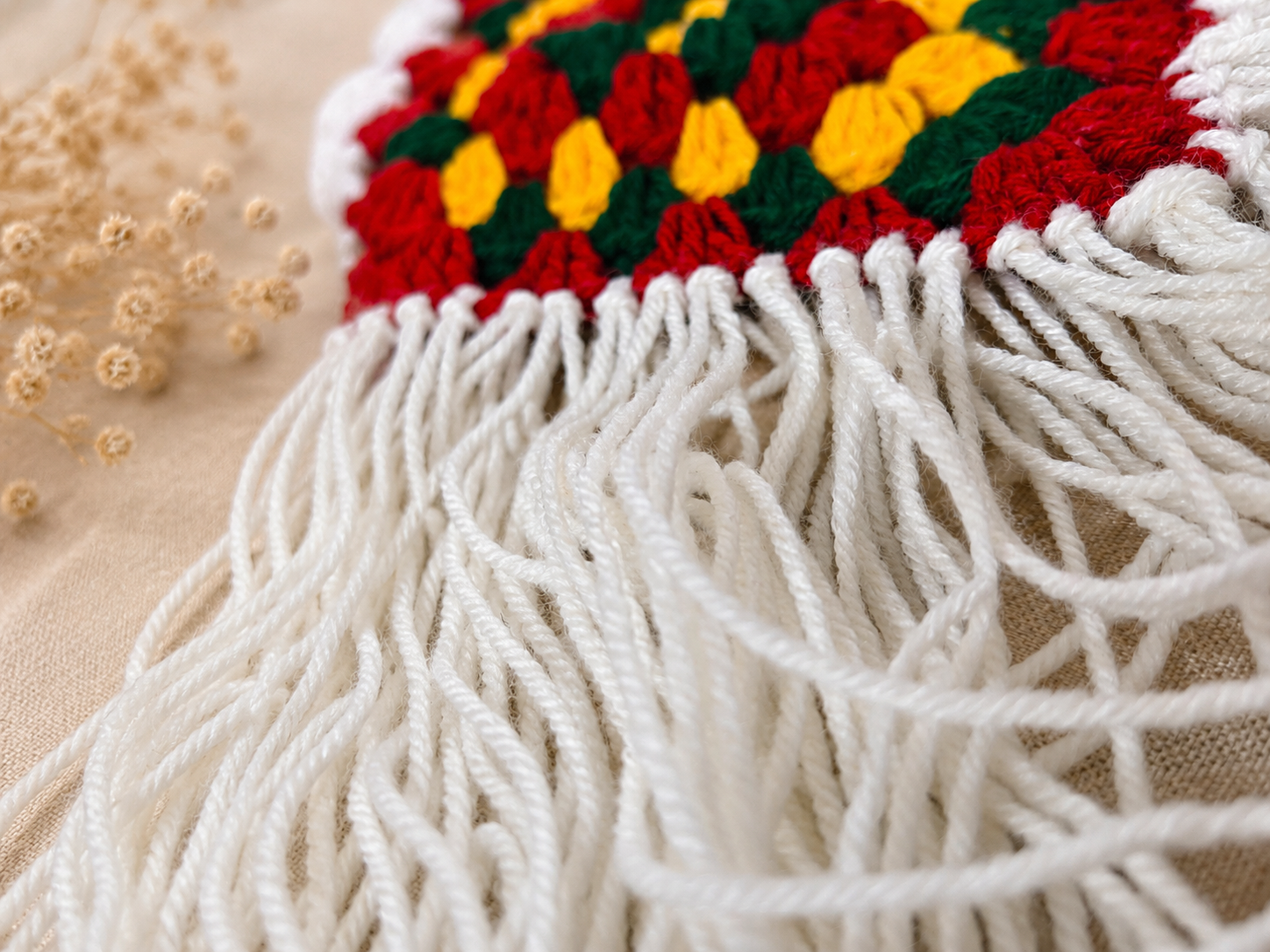 Close-up of the soft white fringe detailing on the handmade Boho Chic Crochet Halter Top, showcasing premium crochet craftsmanship and textured cotton yarn.