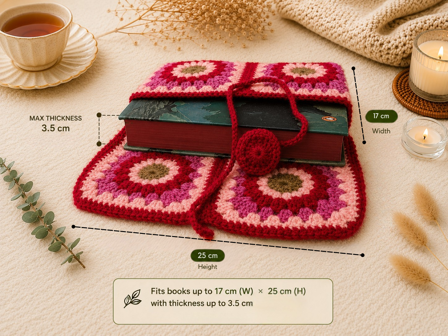 Pink and red handmade crochet book sleeve shown with a thick book inside, with dimension labels for 17 cm width, 25 cm height, and 3.5 cm maximum thickness.